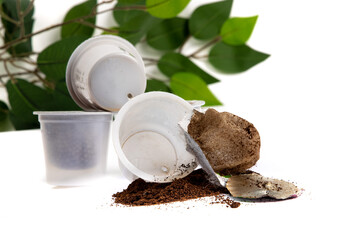 n opened used coffee machine single serving cup pod ready for recycling and composting  isolated on white