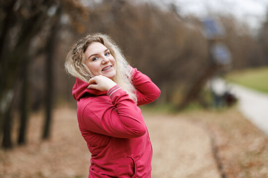 Woman Posing for Picture While Preparing for Outdoor Training