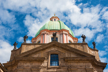 St. Francis Of Assisi Church beautiful dome among clouds in Prague Old Town, a beautiful baroque building erected in 1685 - 766544141
