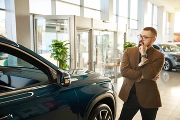 Stoff pro Meter Man in a car dealership chooses a car © Viacheslav Yakobchuk