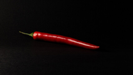 hot chili peppers on black background