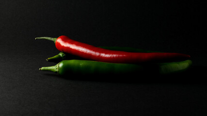 hot chili peppers on black background