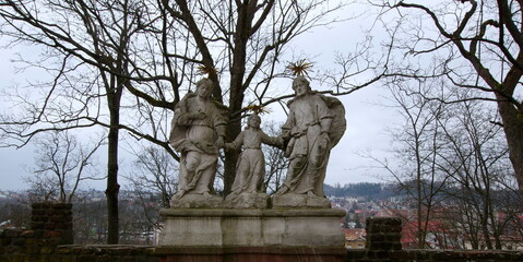 
The Baroque sculpture of the Holy Family is located near the wall between the church and the Karkonosze Museum