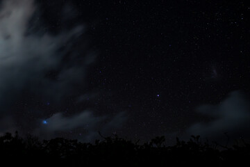 View of stars and clouds at Savinia beach located on the south coast of Mauritius island	