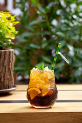 Cold refreshing coctail with llemon and cola - 766569734