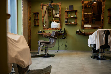 Barbershop workplace with equipment chair and mirror