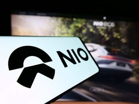 Stuttgart, Germany - 03-16-2024: Mobile phone with logo of Chinese electric vehicle company Nio Inc. in front of business website. Focus on center-left of phone display.