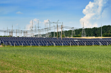 Solar power plant in a green field. Renewable Energy