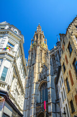 Cathedral of Our Lady Onze-Lieve-Vrouwekathedraal Roman Catholic Gothic style with belfry bell tower, vertical view between buildings, Antwerp city historical centre, Antwerpen old town, Belgium
