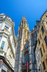 Stof per meter Cathedral of Our Lady Onze-Lieve-Vrouwekathedraal Roman Catholic Gothic style with belfry bell tower, vertical view between buildings, Antwerp city historical centre, Antwerpen old town, Belgium © Aliaksandr