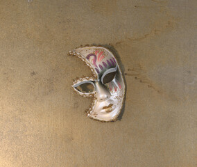 medieval Venetian carnival mask on old background