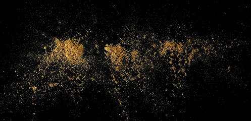 Ginger root powder isolated on black, top view
- 766590114
