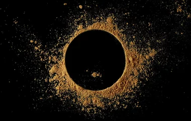 Poster Ginger root powder in shape circle, isolated on black, top view  © dule964