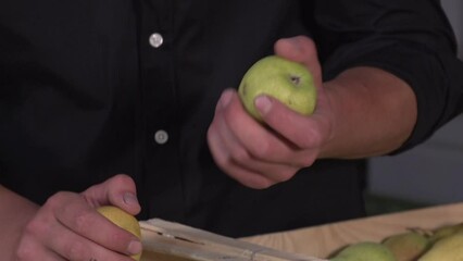 liquor distiller testing pears from crate