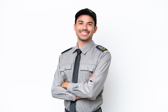 Young safeguard man over isolated white background with arms crossed and looking forward