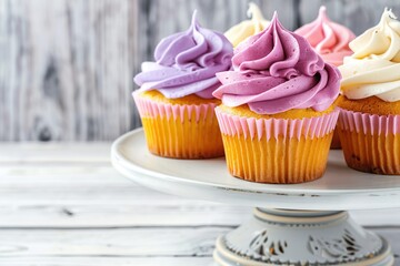 Tasty cupcakes with butter cream on cake stand - obrazy, fototapety, plakaty