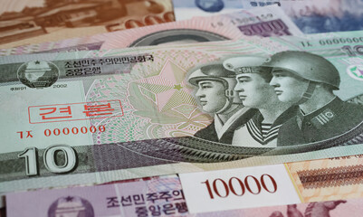 Closeup of old currency North Korean Won banknote - War economy and military armament compensation...
