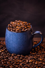 many macro aromatic coffee beans in a cup