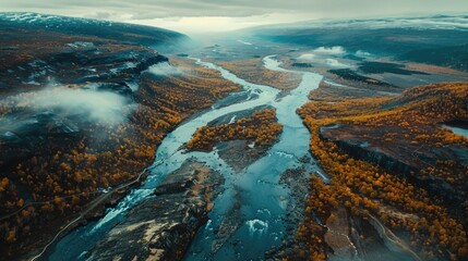 Aerial view of a river flowing through a scenic valley. Ideal for nature and landscape backgrounds