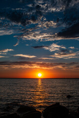 Sun touches the edge of Lake Newell as it sets