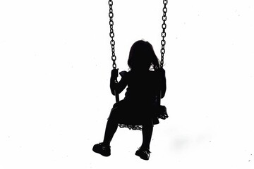 Silhouette of a girl sitting on a swing, perfect for lifestyle and outdoor concepts