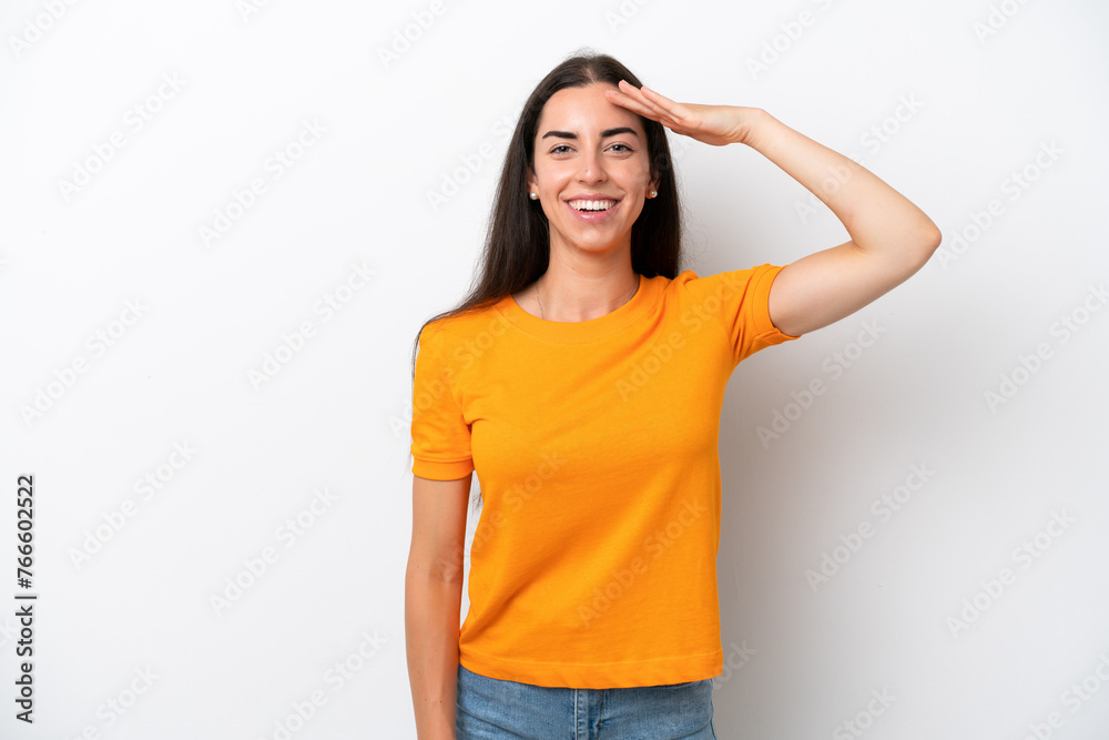 Sticker Young caucasian woman isolated on white background saluting with hand with happy expression