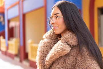 Young brunette woman at outdoors With glasses