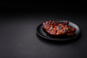 Fresh juicy delicious beef steak on a dark background