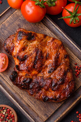 Fresh juicy delicious beef steak on a dark background