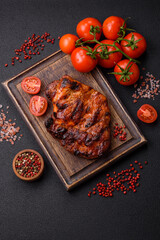 Fresh juicy delicious beef steak on a dark background