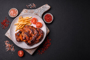 Fresh juicy delicious beef steak on a dark background