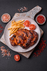 Fresh juicy delicious beef steak on a dark background