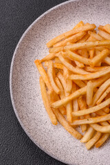 Delicious crispy golden fries with salt and spices - 766604521