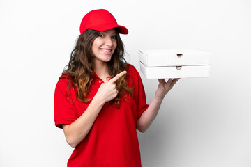 Pizza delivery woman with work uniform picking up pizza boxes isolated on white background pointing...