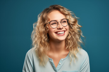 Fototapeta premium Young pretty blonde girl over isolated colorful background with glasses