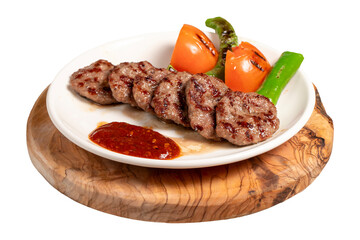 Grilled meat balls isolated on white background. With Tomatoes, Peppers, Appetizers and Special Sauce. Turkish meatballs on a plate