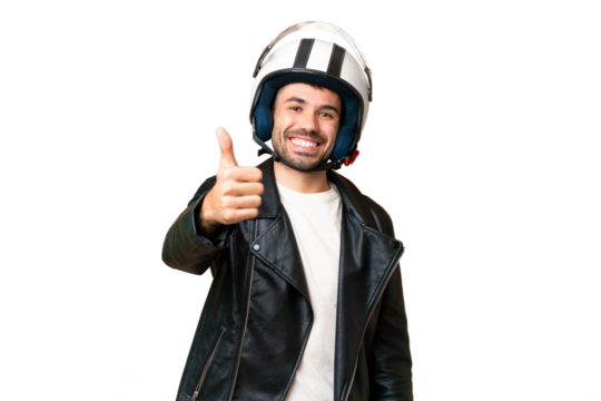 Young caucasian man with a motorcycle helmet over isolated chroma key background with thumbs up because something good has happened