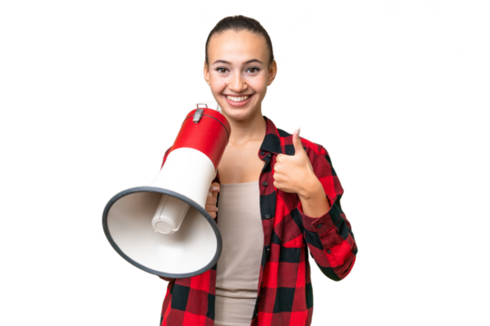 Young Arab woman over isolated background holding a megaphone with thumb up