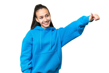 Young Arabian woman over isolated chroma key background giving a thumbs up gesture