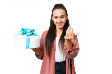 Young Arabian woman holding birthday cake over isolated chroma key background inviting to come with hand. Happy that you came