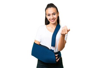 Young Arabian woman with broken arm and wearing a sling over isolated chroma key background...