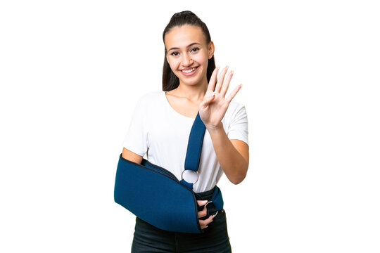 Young Arabian woman with broken arm and wearing a sling over isolated chroma key background happy and counting four with fingers