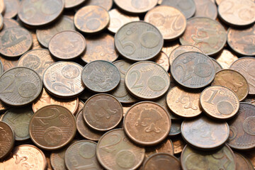 Euro cent coins texture background. One, two and five euro cent coins. Pile of euro cent coins.