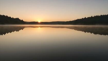 Fototapeta na wymiar A Breathtaking Sunrise Over A Calm Lake Casting A