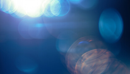 Blue abstract smooth bokeh light leak, water blurred motion, sunlight lens flare