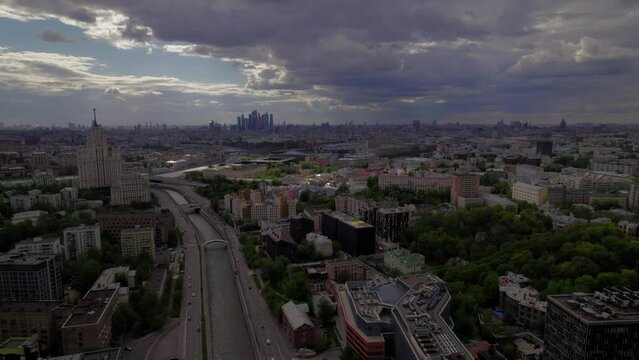 A captivating aerial view of Moscow's bustling city center and its picturesque surroundings, captured gracefully by a drone. The footage showcases iconic landmarks and urban landscapes