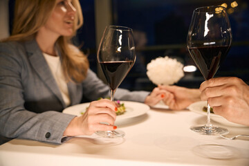 Couple has a nice conversation over dinner in cozy restaurant