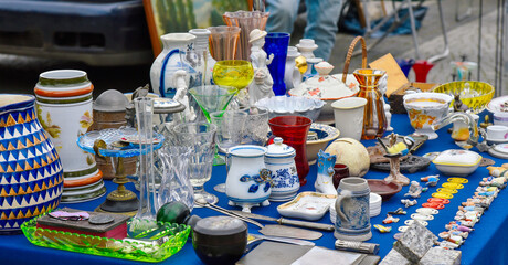 Old items on table on garage sell flea market