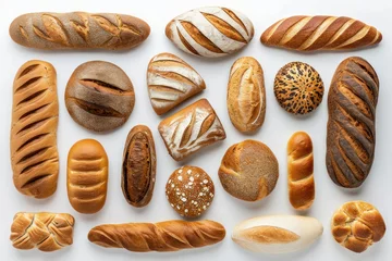 Poster Assortment of various types of bread including rolls, loaves, and baguettes on a white surface © SHOTPRIME STUDIO