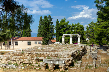 Remains of the Roman temple attributed to Octavia, sister of Augustus, enclosed with Corinthian columns, at ancient Corinth, Peloponnese, Greece, Europe.